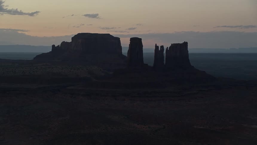 View of a valley with rock formations at dawn