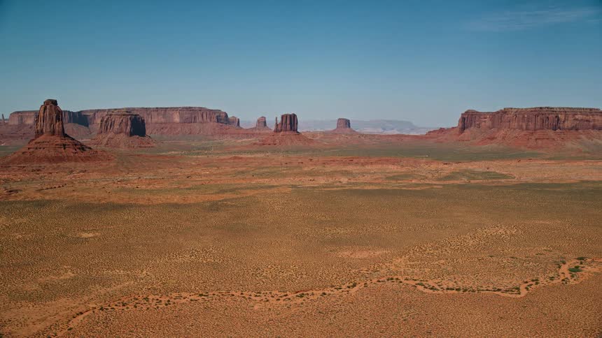 A desert region and some sloping rock formations