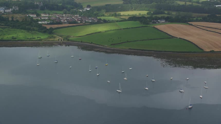 Aerial of a rural area with a bay with anchored small boats