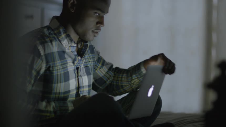 A man is using a laptop