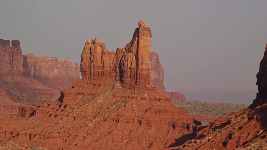 A pointy rock formation in a desert