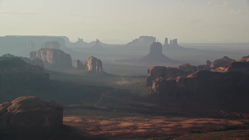 A rock formation with mountains of stones in the desert
