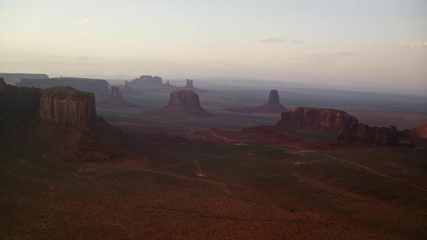 Aerial view of the plateaus rising amidst the vast desert