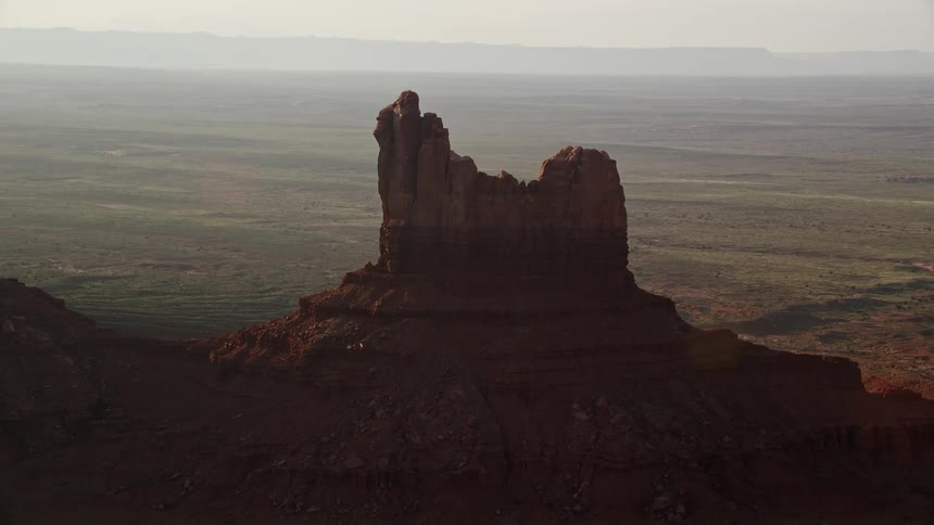 Aerial of peak of red mountain in wild desert