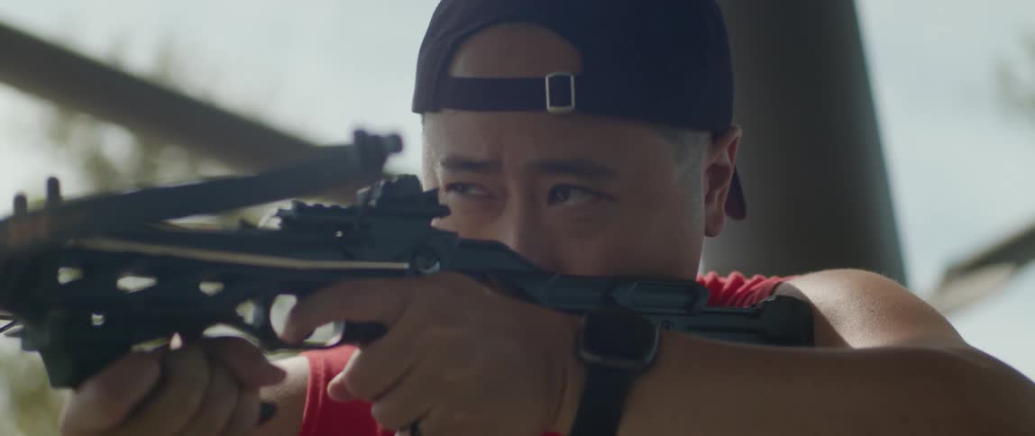 A man shoots an arrow after aiming for a while at midday