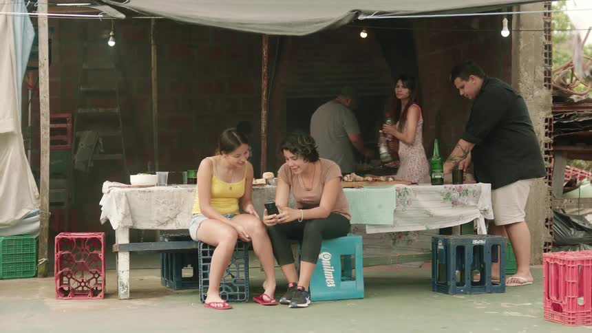 A group are having a barbeque outside