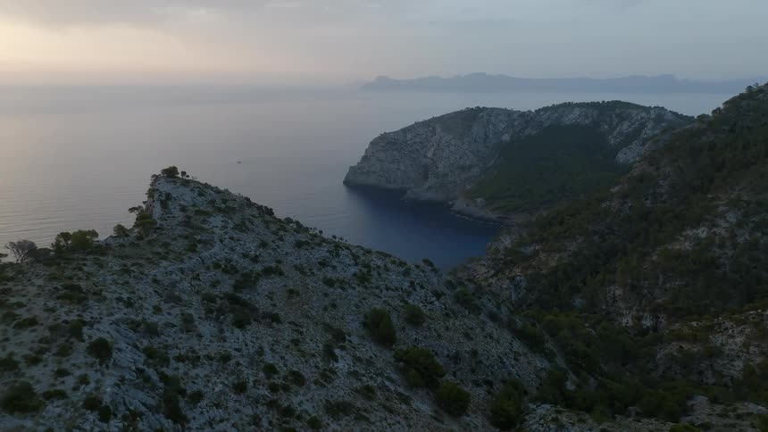 View of a coastal mountain range at dawn