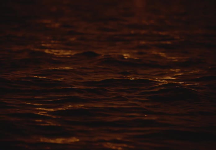 Seawater with small waves at dusk