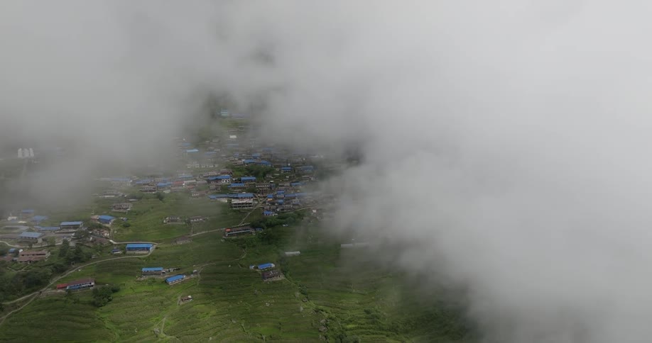 The clouds are hovering over the rural town