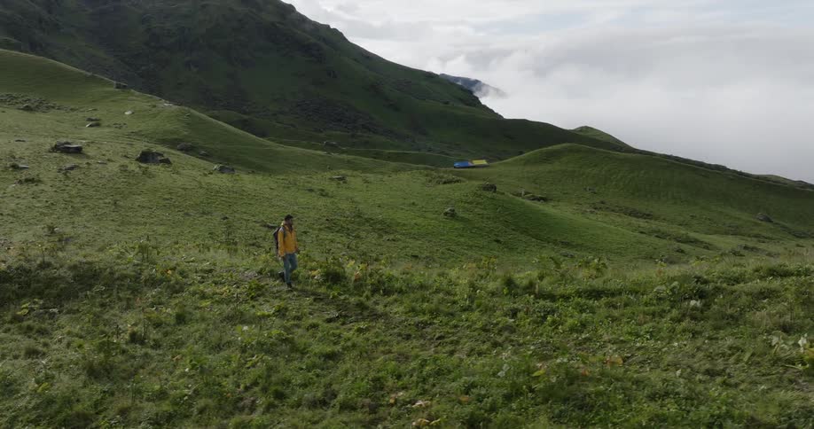 A woman is hiking on the mountain
