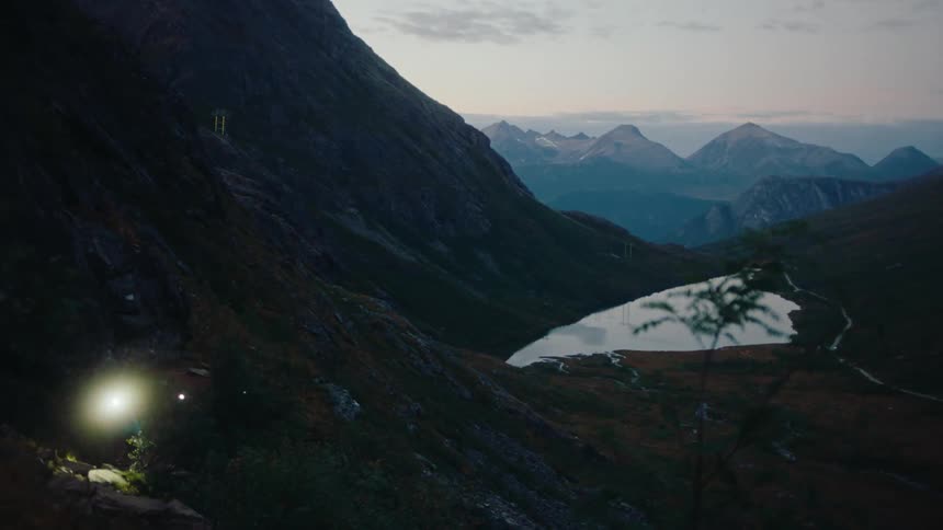 Two people hiking during a morning in the mountains