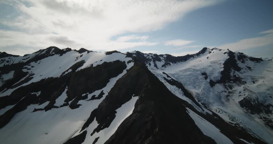 Aerial view of the snow covered slopes of a mountain range