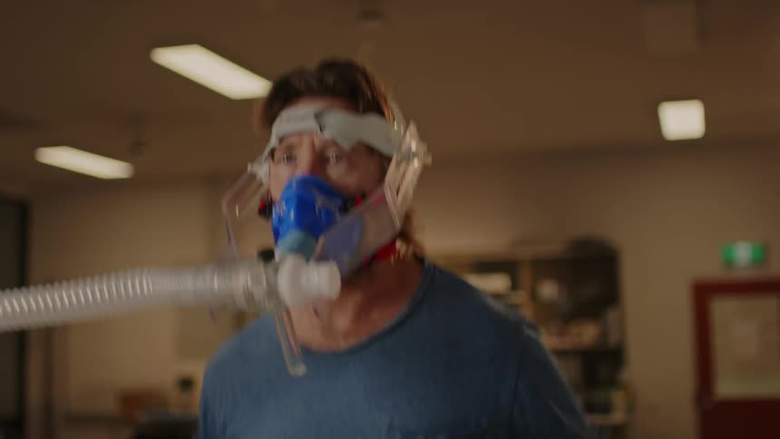 A man exercising indoors