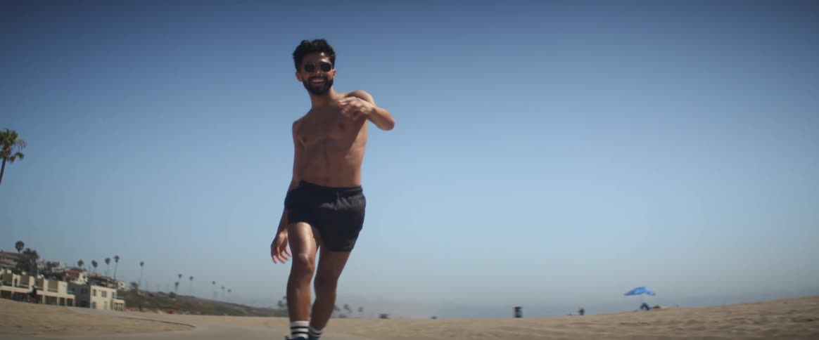 An hispanic man skate dancing on the road