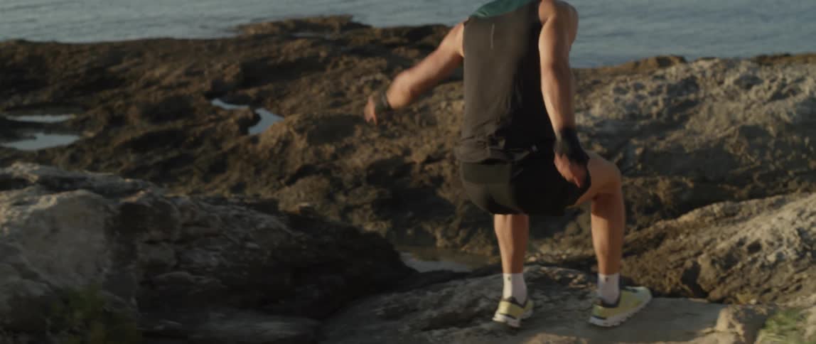 A person running on rocks