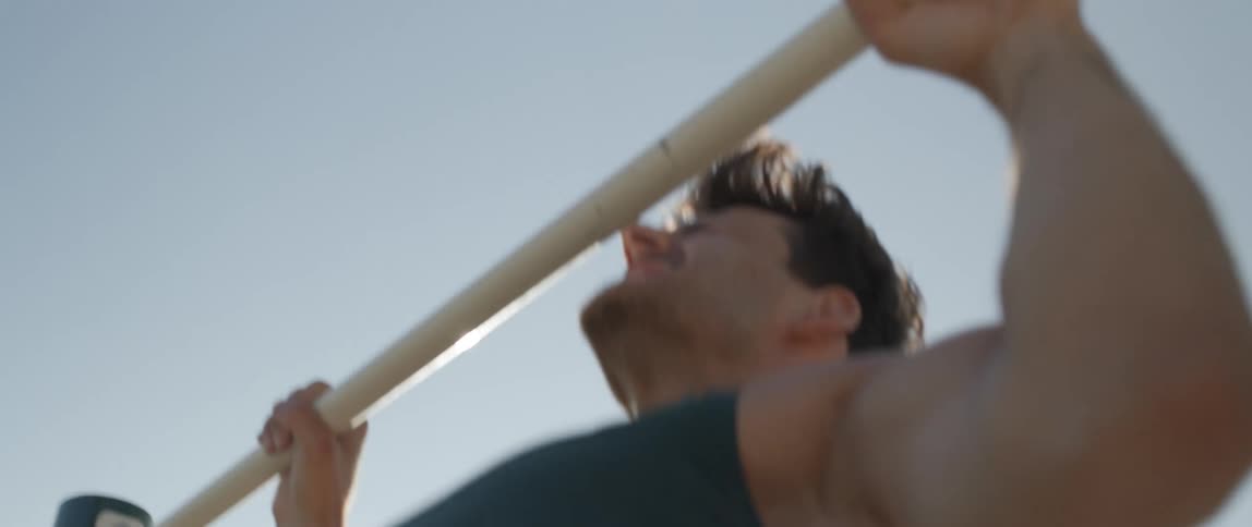 A man doing pullups outside