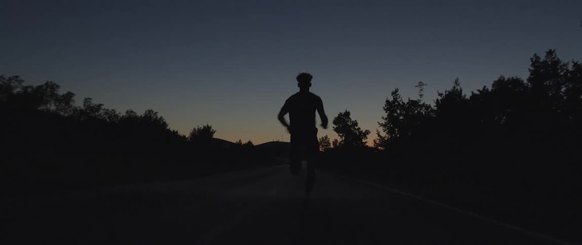 A man is running at night