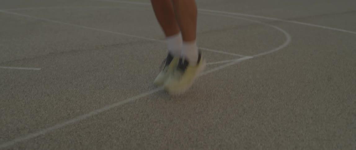 A man is jumping rope on the court
