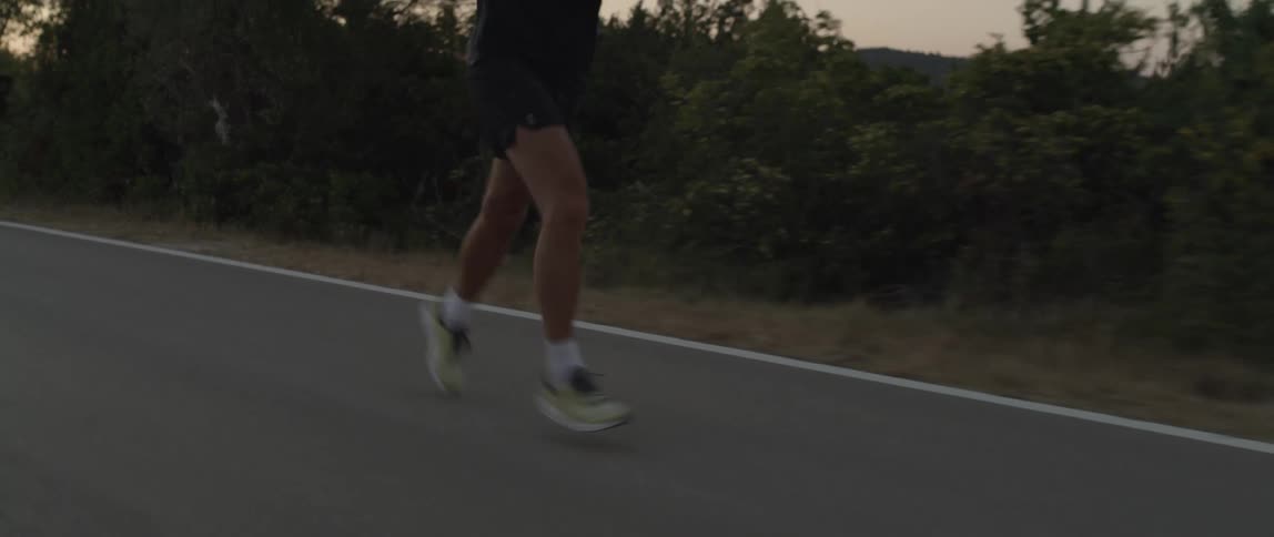 A man running by the road side