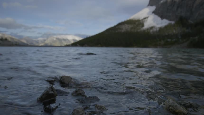 Water moves along rocks by the shore