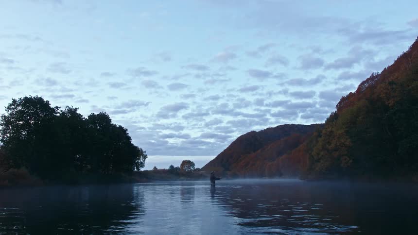 A man is fishing in the river
