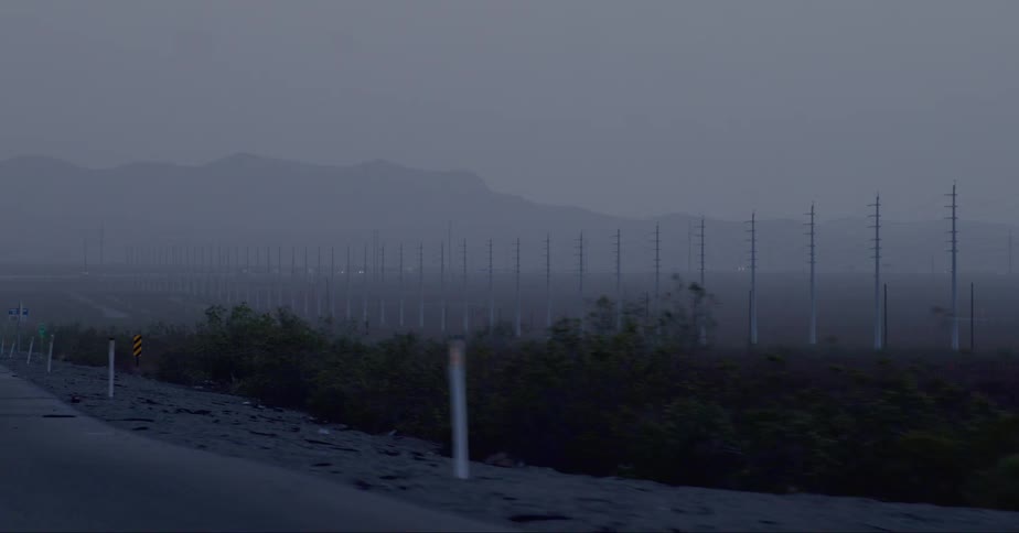 View of electric power towers on a completely foggy day