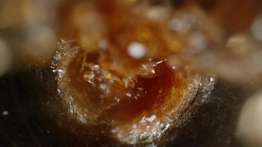 Soda being poured into a glass