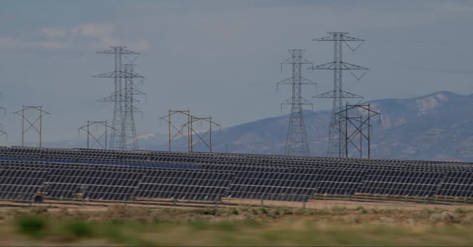 Photovoltaic power station seen from a moving vehicle in the desert