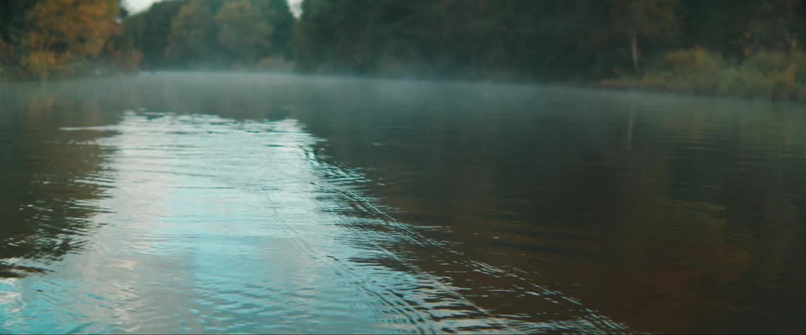 View of the river with mist and a rope being thrown
