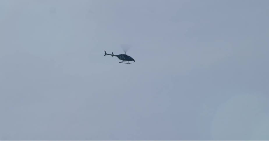 View of a helicopter in motion during the day