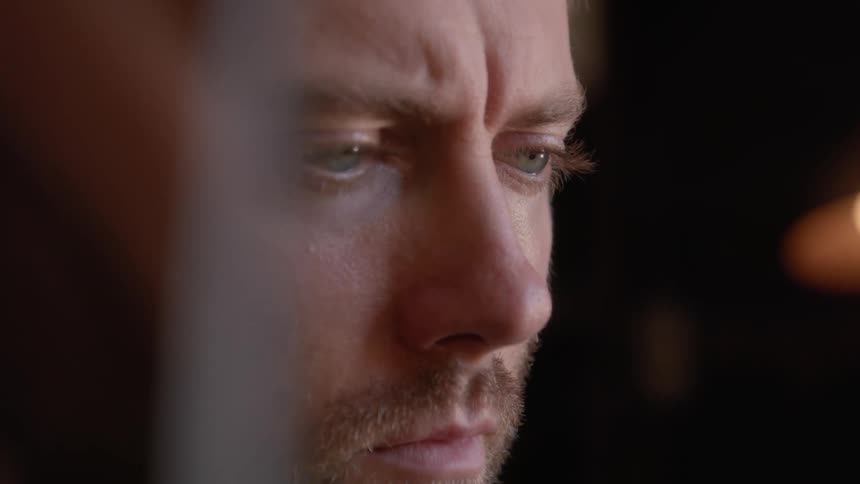 A man looking very sad just looking in dismayed