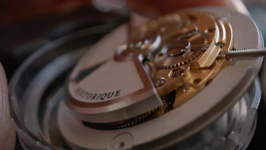 Man disassembles wristhwatch