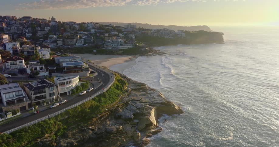 Aerial view of a coastal town at sunset