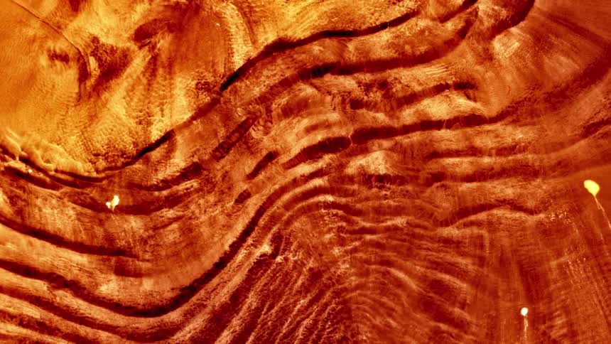 Red liquid abstract texture in a moving pattern