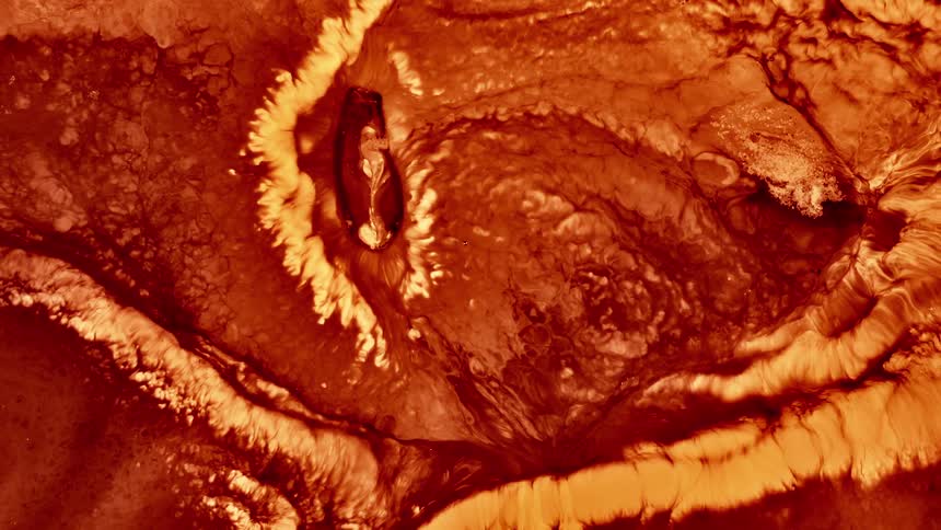 The surface of a star that is experiencing a large storm and explosion