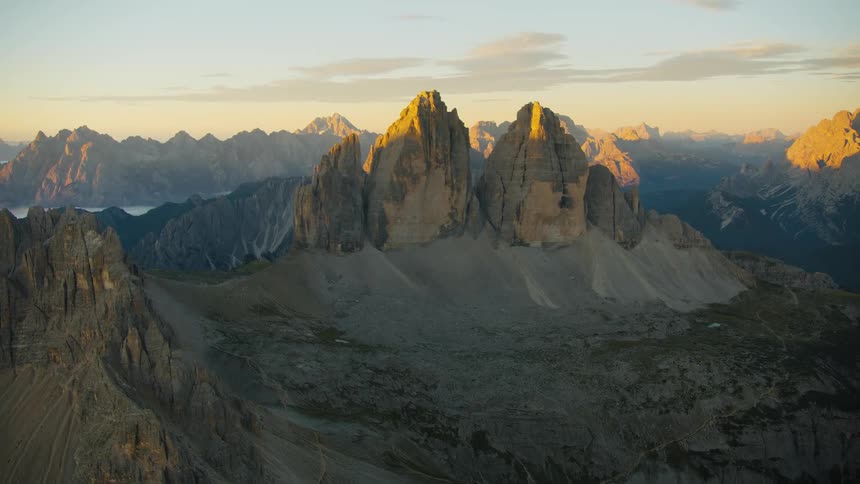 A region with many tall and pointy mountains illuminated by sunlight