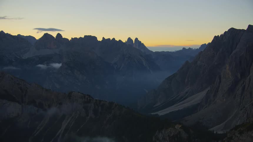 Mountains covered in fogs at sunset