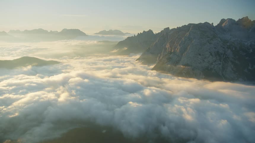 Huge stone mountains above the clouds