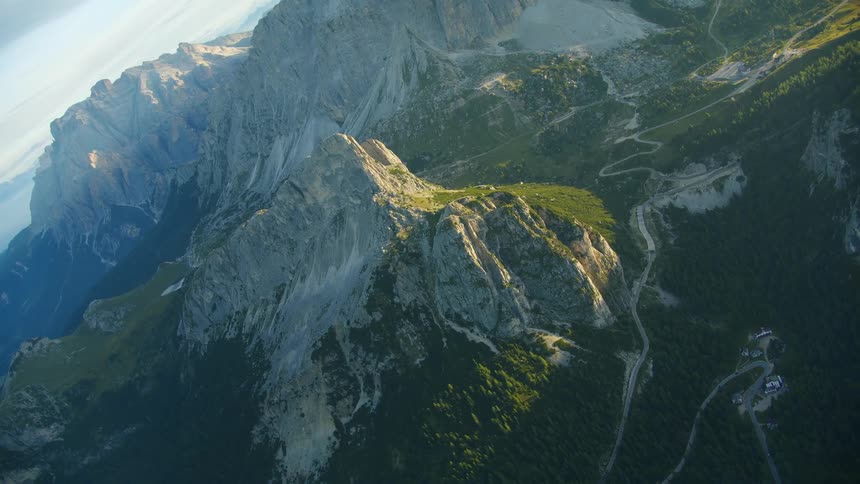 Aerial view of mountains and cliffs with the sunlight of dawn