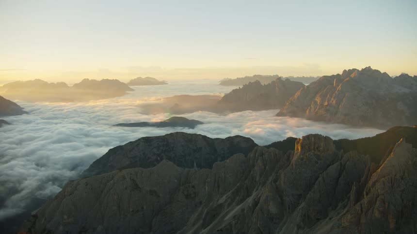 Mountains covered in fogs at sunset