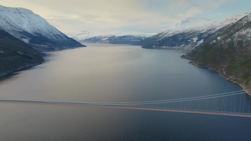 Bridge over water in winter mountain valley