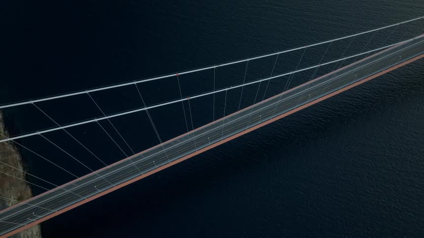 A huge bridge with a road over a sea