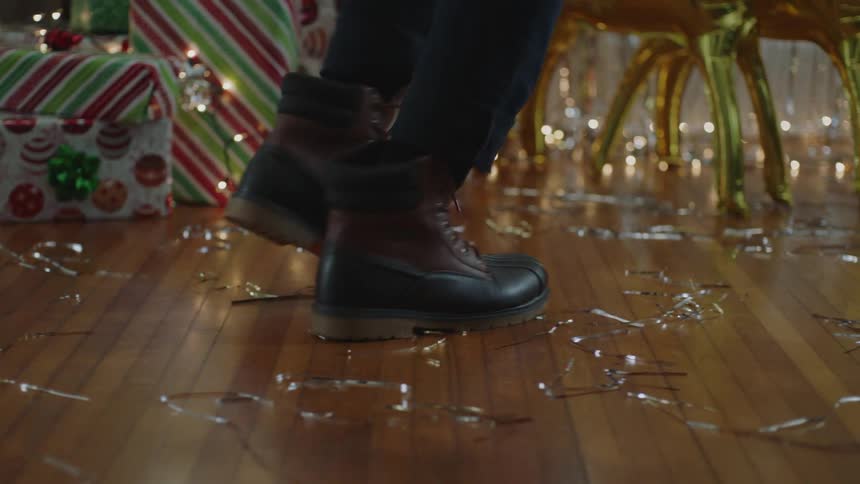 A closeup of a persons feet walking in a straight line and dancing