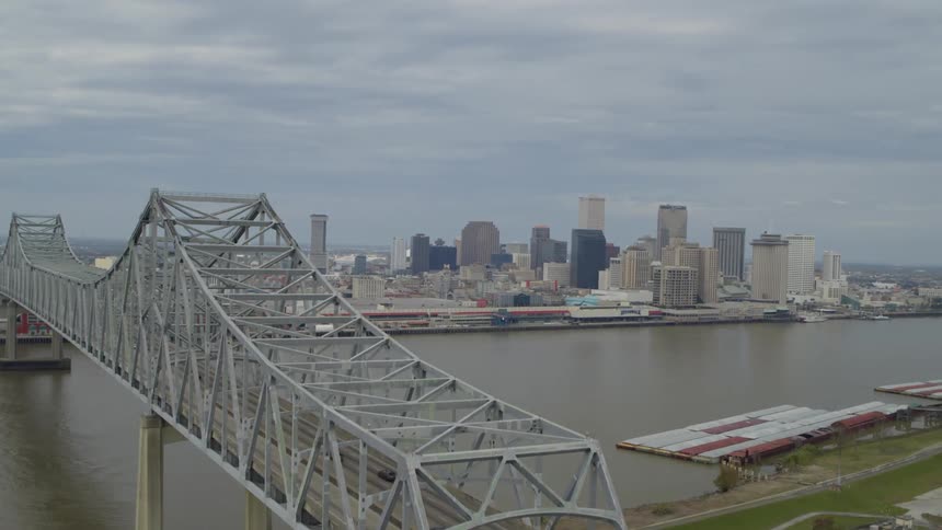 Aerial view of two bridges over a river leading to the city