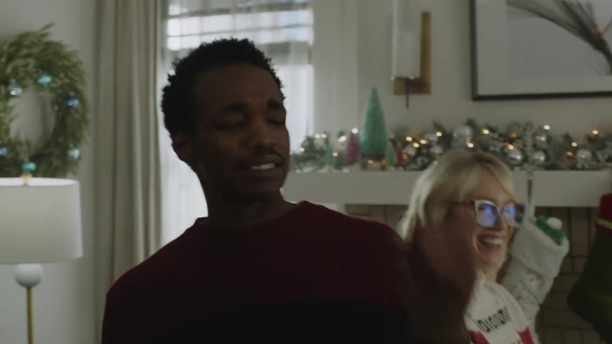 Several people having fun dancing together in a room