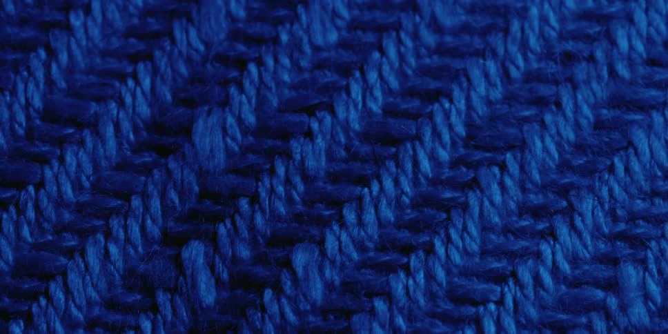 A time lapse from day to night is reflected onto a blue woven rug