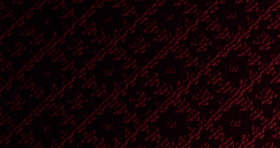 An abstract object with a texture of lines being illuminated and then turned off
