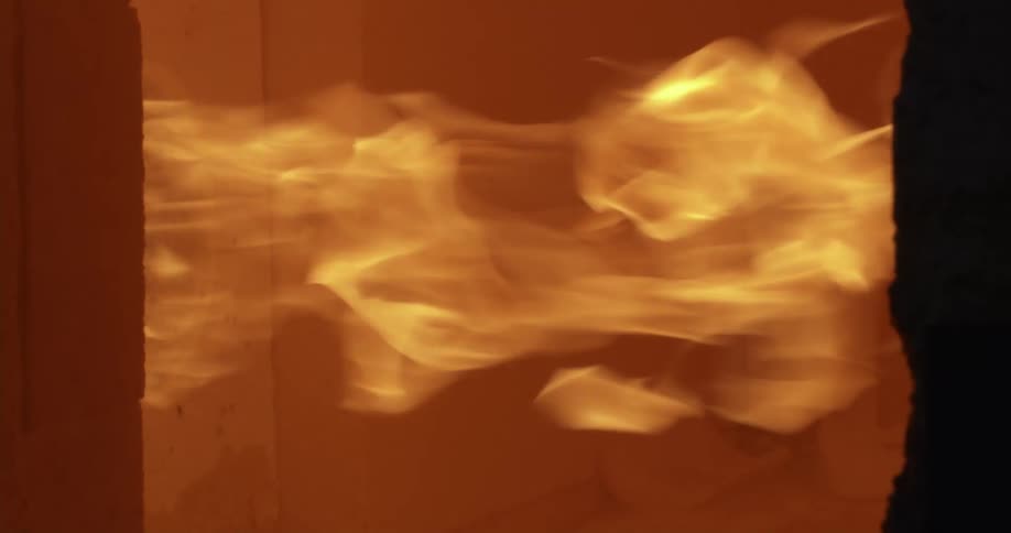 Closeup of a machine emitting a large amount of fire