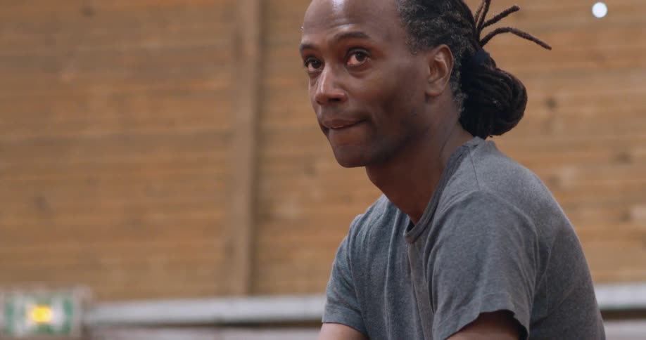 A concentrated man hitting a tennis ball