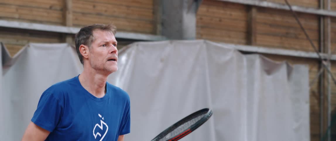 A man is playing tennis